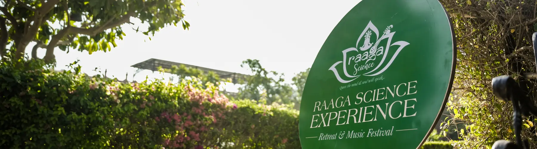 The Raaga Science Experience signboard in the garden at first light